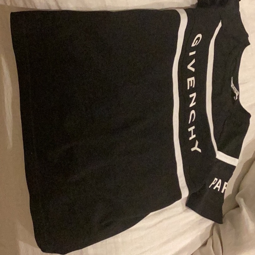 I am selling this Givenchy shirt it is size 8 in kids and is black